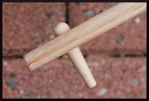 Pin viewed with the bit of the axe facing away from the viewer.